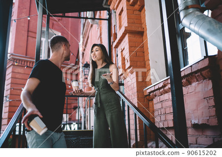 Unhappy hipster guys discussing divorce details and disagreement while breaking up 90615202