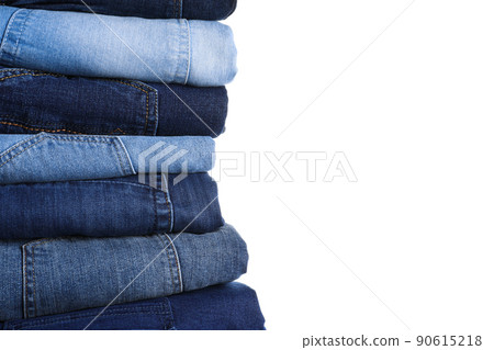 Stack of different jeans isolated on white 90615218