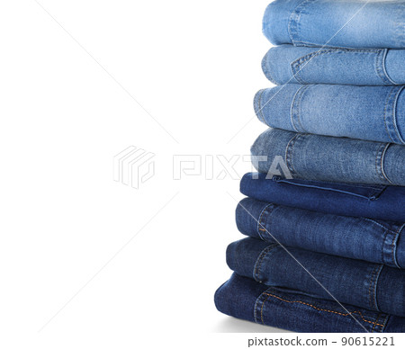 Stack of different jeans isolated on white 90615221