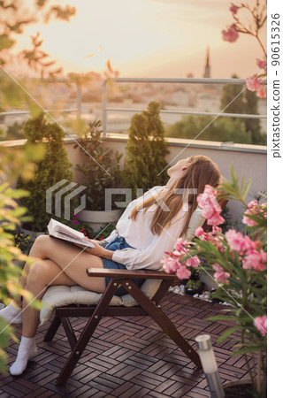 Dreaming Woman with Book on Knees Dreaming Woman with Book on Knees 90615326