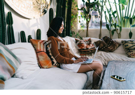 Woman using laptop for browsing while having break Woman using laptop for browsing while having break 90615717