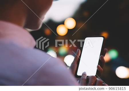 Crop person using application on smartphone 90615815