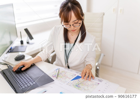 Young female engineer trade area analysis marketing research eyeglasses 90616177