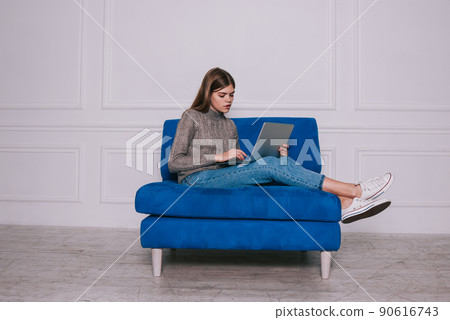Focused freelancer working on laptop 90616743