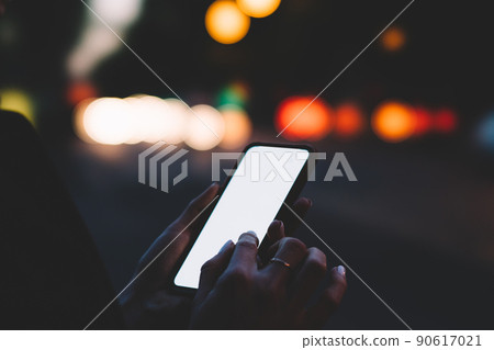 Crop person using mobile phone applications with internet 90617021
