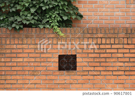 Brown brick wall and green leaf at Yeonhui-dong street in Seoul, Korea 90617801