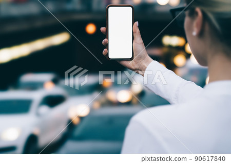 Crop faceless woman taking shot in city Crop faceless woman taking shot in city 90617840