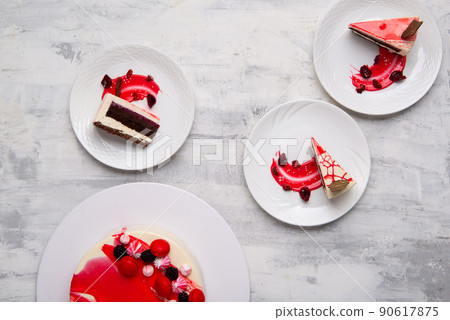 Top view of slices of tasty cake on white plates 90617875
