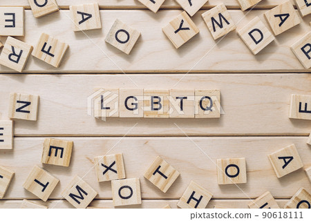 Abbreviation LGBTQ with letter blocks on wooden background Abbreviation LGBTQ with letter blocks on wooden background 90618111