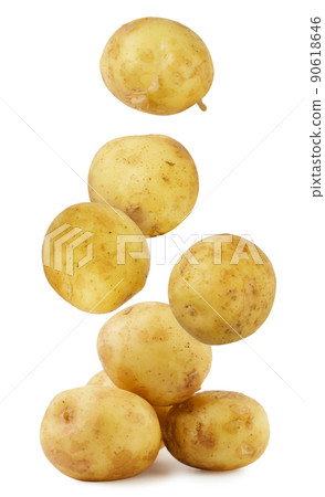 Young potatoes falling on a pile on a white background. Isolated 90618646
