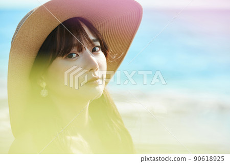 Young woman enjoying a resort on the beach Young woman enjoying a resort on the beach 90618925