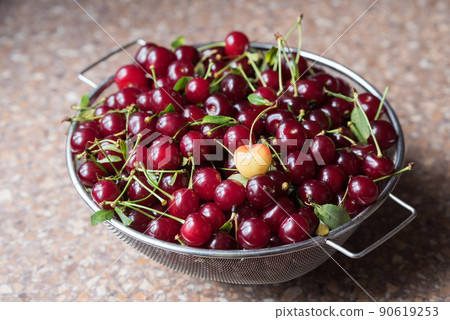 Cherries in a steel sieve. top view, texture Cherries in a steel sieve. top view, texture 90619253