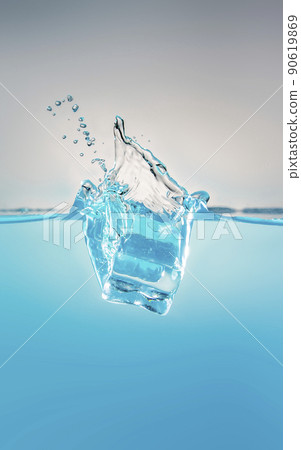 object falling into blue water until splashing on a gray background 90619869