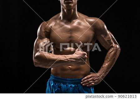 Part of a man's body on a dark background with copyspace 90621013
