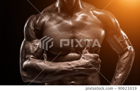 Part of a man's body on a dark background with copyspace Part of a man's body on a dark background with copyspace 90621019