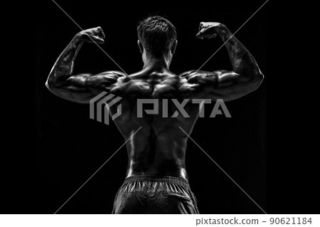 Strong Athletic Man Fitness Model posing back muscles, triceps o Strong Athletic Man Fitness Model posing back muscles, triceps o 90621184