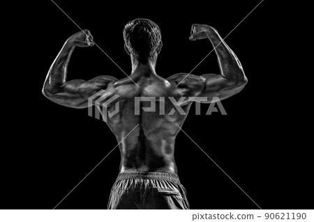 Strong Athletic Man Fitness Model posing back muscles, triceps o Strong Athletic Man Fitness Model posing back muscles, triceps o 90621190
