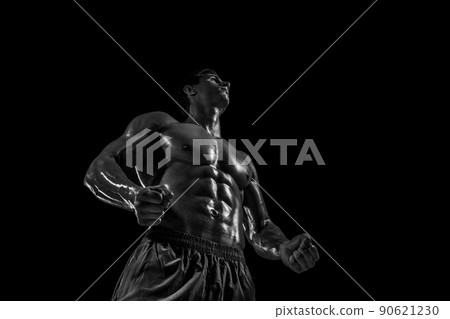 Muscular and fit young bodybuilder fitness male model posing ove Muscular and fit young bodybuilder fitness male model posing ove 90621230
