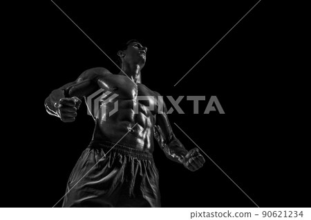 Muscular and fit young bodybuilder fitness male model posing ove Muscular and fit young bodybuilder fitness male model posing ove 90621234