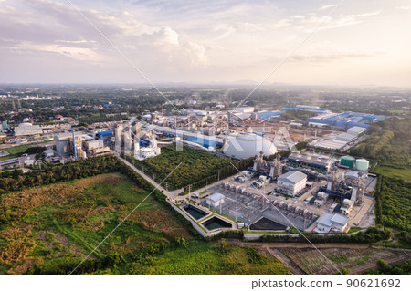 Aerial view of large green energy processing plant with building warehouse, refinery tower, warehouse and chemical processing technology Aerial view of large green energy processing plant with building warehouse, refinery tower, warehouse and chemical processing technology 90621692