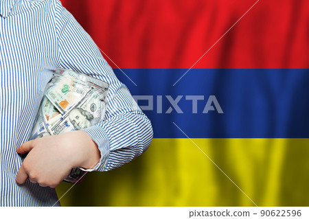 Currency exchange, banking and business in Armenia. Hand holds American dollars money Currency exchange, banking and business in Armenia. Hand holds American dollars money 90622596