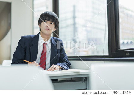 High school boys taking classes at a prep school High school boys taking classes at a prep school 90623749