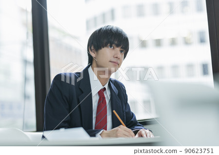 High school boys taking classes at a prep school High school boys taking classes at a prep school 90623751