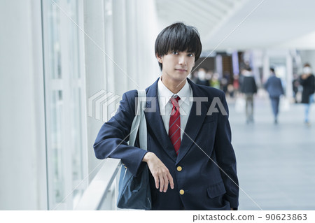 High school boys commuting to school 90623863