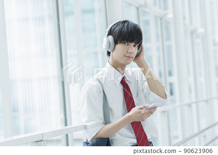 High school boy listening to music High school boy listening to music 90623906