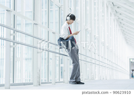High school boy listening to music High school boy listening to music 90623910
