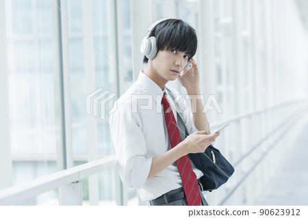 High school boy listening to music High school boy listening to music 90623912