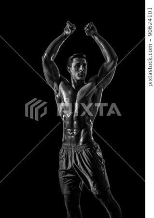 Muscular and fit young bodybuilder fitness male model posing ove Muscular and fit young bodybuilder fitness male model posing ove 90624101