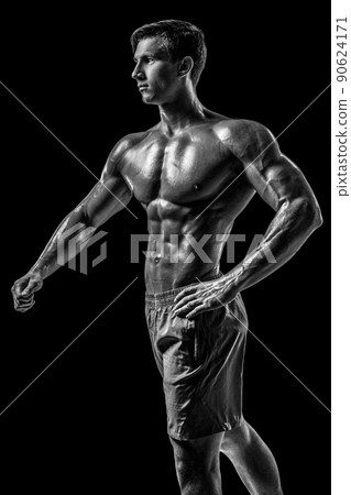 Muscular and fit young bodybuilder fitness male model posing ove Muscular and fit young bodybuilder fitness male model posing ove 90624171