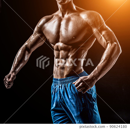 Muscular and fit young bodybuilder fitness male model posing ove Muscular and fit young bodybuilder fitness male model posing ove 90624180