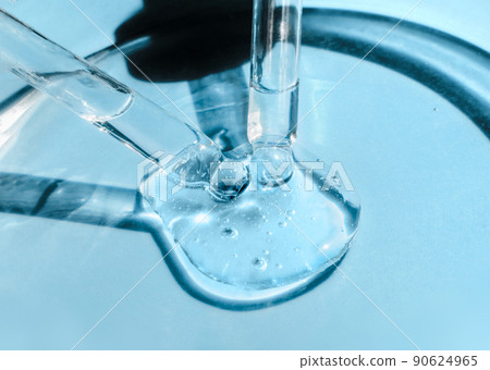 Two pipettes with serum, oil and face gel cleaner in a glass petri dish. Cosmetics and healthcare concept closeup. Dose of retinol with air bubbles. Flat lay. Monkeypox, coronavirus research Two pipettes with serum, oil and face gel cleaner in a glass petri dish. Cosmetics and healthcare concept closeup. Dose of retinol with air bubbles. Flat lay. Monkeypox, coronavirus research 90624965