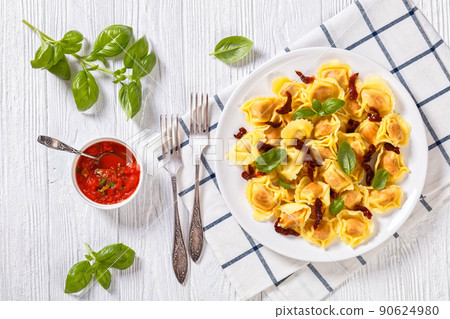 italian Tortelloni stuffed with sun dried tomatoes italian Tortelloni stuffed with sun dried tomatoes 90624980