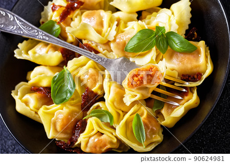 italian Tortelloni stuffed with sun dried tomatoes italian Tortelloni stuffed with sun dried tomatoes 90624981