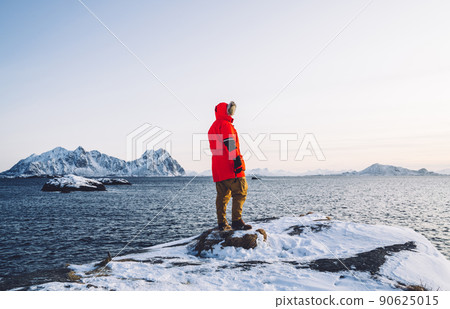 Man traveler enjoying arctic destination and nature with cold ice landscape Man traveler enjoying arctic destination and nature with cold ice landscape 90625015