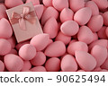 beauty background a bunch of pink gentle makeup sponges and a pink gift 90625494