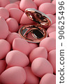 beauty background a bunch of pink gentle makeup sponges and a mirror vertical orientation 90625496