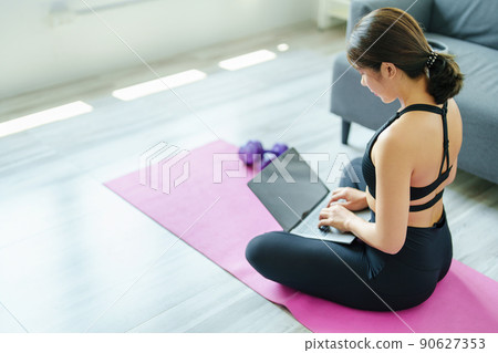 stress relief, muscle relaxation, breathing exercises, exercise, meditation, Young Asian woman relaxing her body from office work by practicing yoga by watching online tutorials 90627353