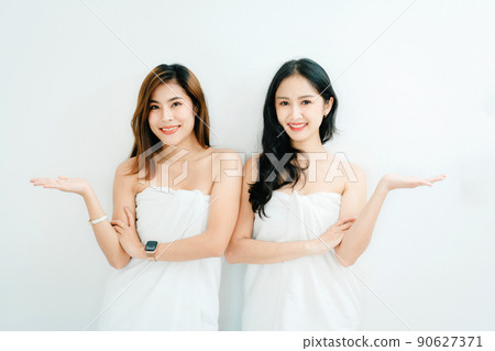 lgbtq, LGBT concept, homosexuality, portrait of two Asian women posing happy together and showing love for each other while taking a shower. 90627371