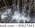 water falling into the fountain 90627443