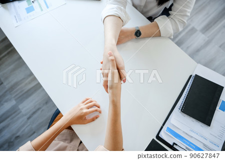 Young businesswoman collaborate with partners to increase their business investment network for Plans to improve quality next month in their office. agreement concept 90627847