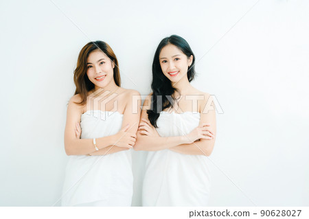 lgbtq, LGBT concept, homosexuality, portrait of two Asian women posing happy together and showing love for each other while taking a shower. 90628027
