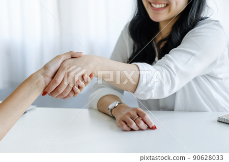 Young businesswoman collaborate with partners to increase their business investment network for Plans to improve quality next month in their office. agreement concept 90628033