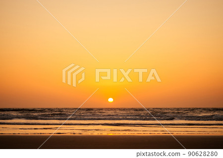 romantic sunset on the beach by the ocean mock up 90628280