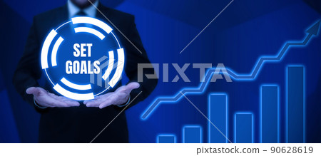 Writing displaying text Set Goals. Business concept Defining or achieving something in the future based on plan Lady in suit holding pen symbolizing successful teamwork accomplishments. 90628619