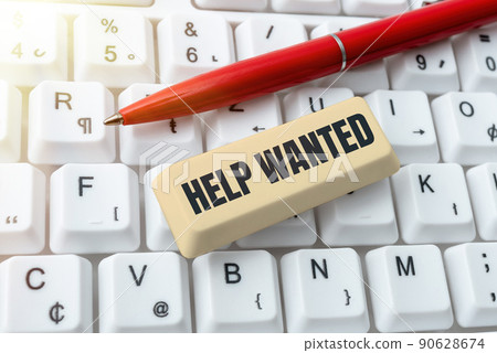 Handwriting text Help Wanted. Internet Concept advertisement placed in newspaper by employers seek employees Lady in suit holding pen symbolizing successful teamwork accomplishments. 90628674