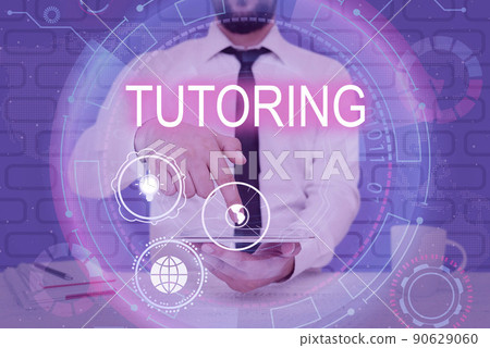 Text showing inspiration Tutoring. Business overview An act of a person employed to administer knowledge to someone Businessman pointing down tablet represents global innovative thinking. 90629060